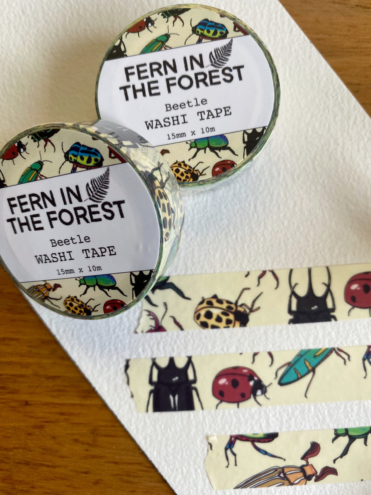 Roll of washi tape with beetle drawings on it.