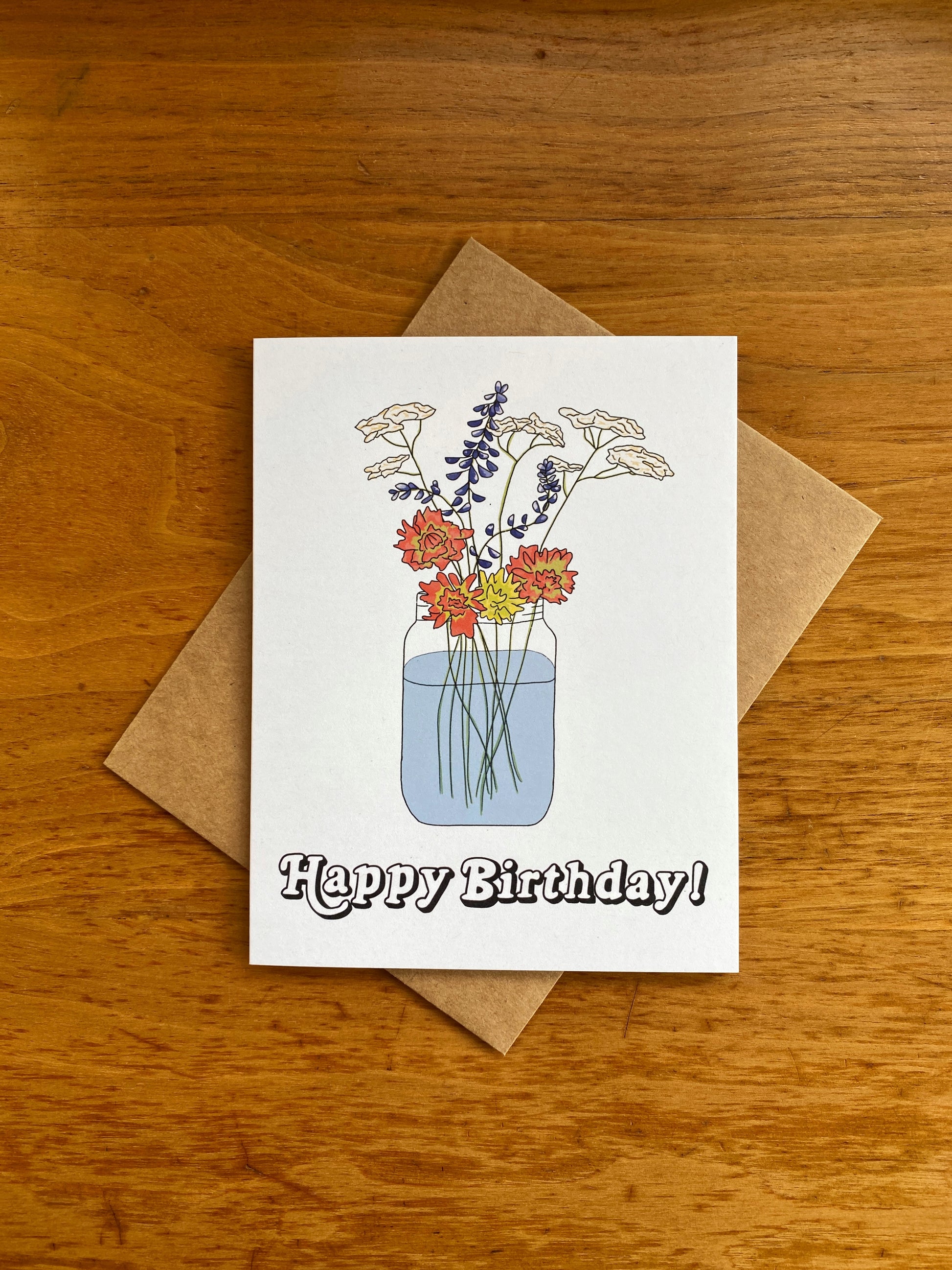 Greeting card with Wildflower bouquet in a mason jar with "Happy Birthday" written underneath.