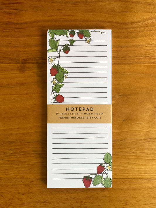 lined notepad with strawberry drawings