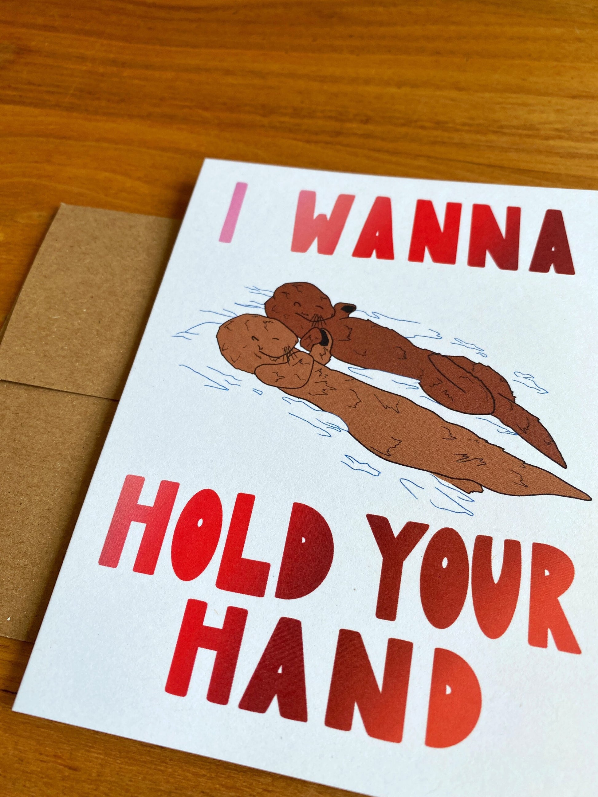 "I wanna hold your hand" otters holding hands card